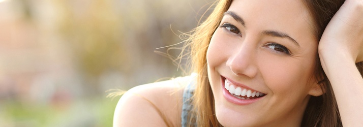 Smiling woman representing successful chiropractic care results
