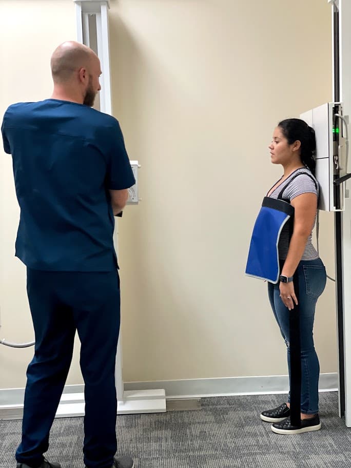 Chiropractor evaluating patient posture