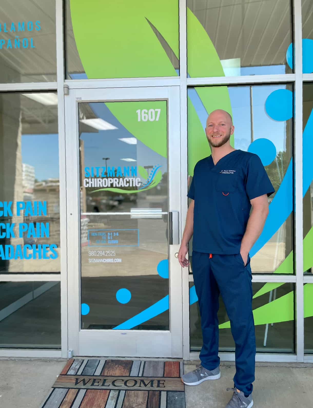 Chiropractor standing outside clinic