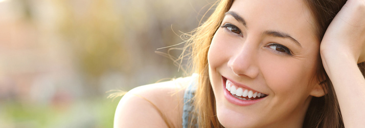 Smiling woman representing successful chiropractic care results