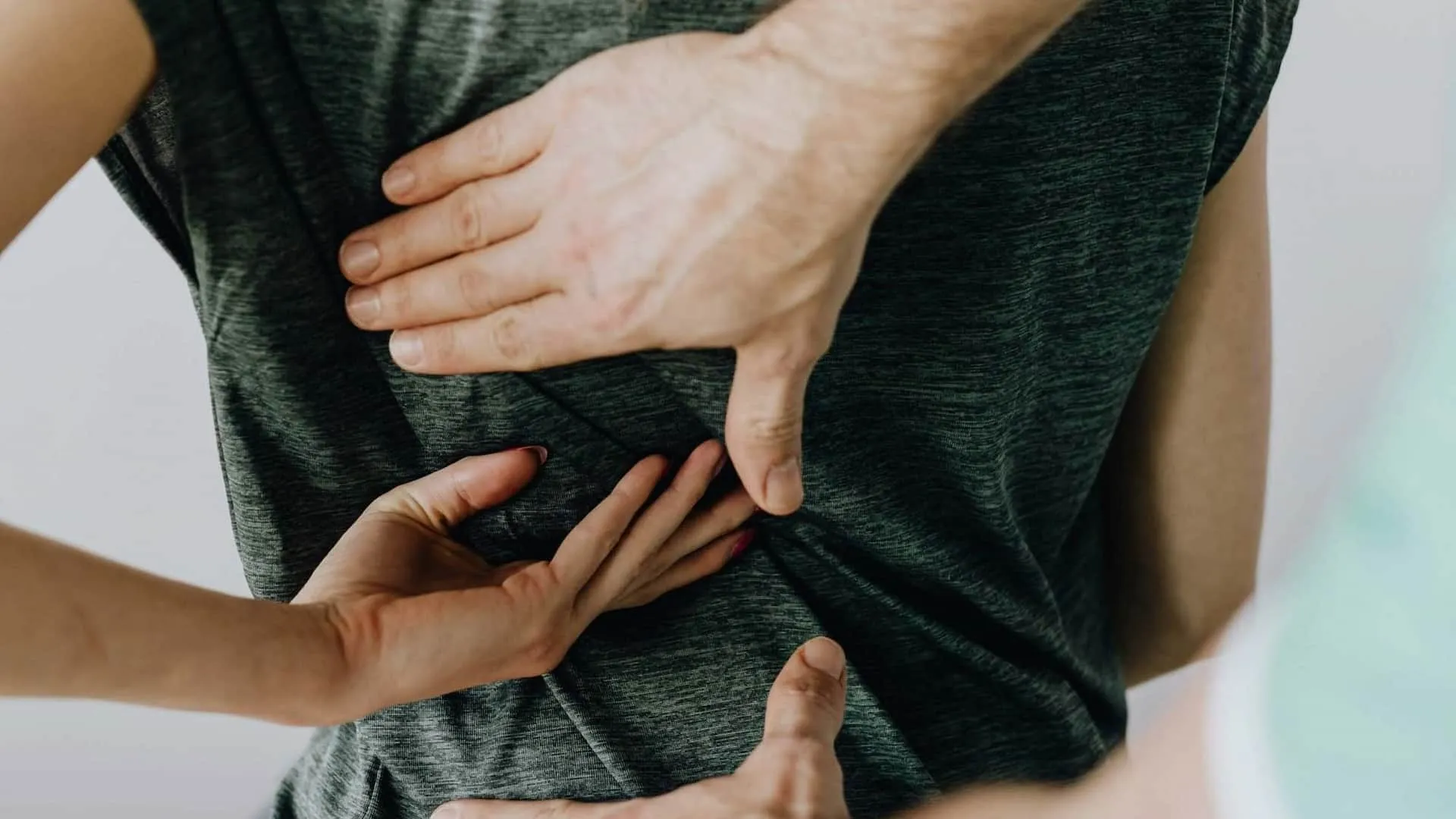 Chiropractic adjustment of lower back using manual therapy techniques for back pain treatment