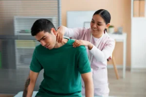Chiropractor consulting with patient about treatment plan and visit frequency