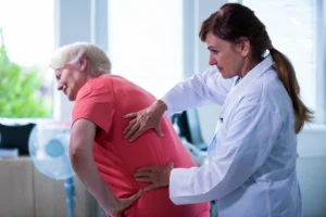 Senior patient receiving gentle chiropractic adjustment to improve mobility and reduce joint pain