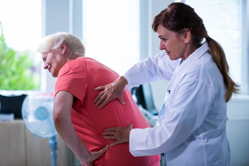 Senior patient receiving gentle chiropractic adjustment to improve mobility and reduce joint pain
